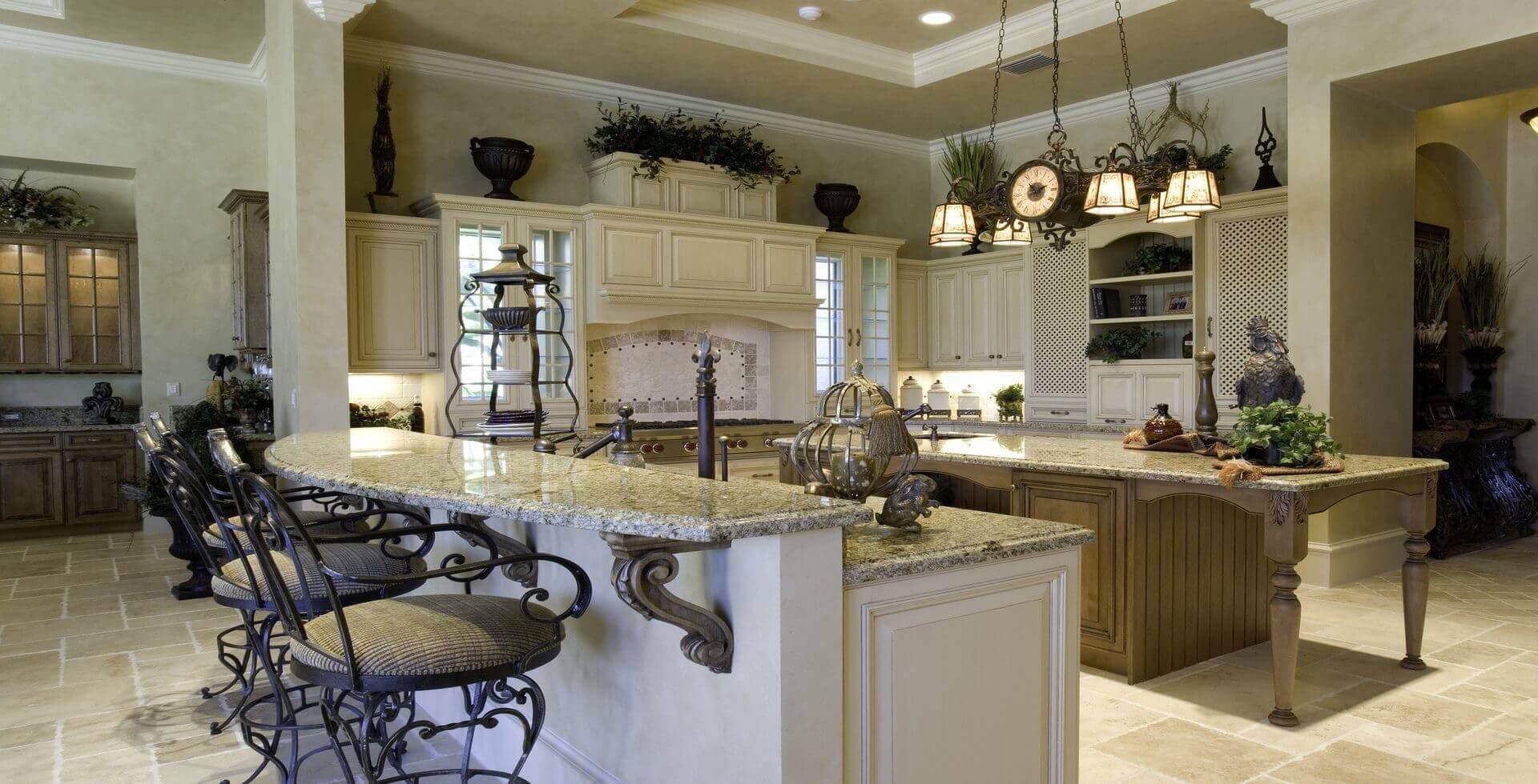 Elegant kitchen with granite countertops and barstools.