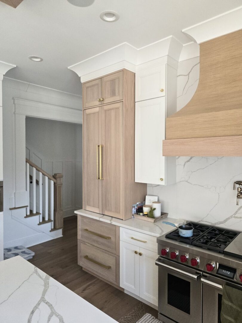 Modern kitchen with wooden cabinets and stove.