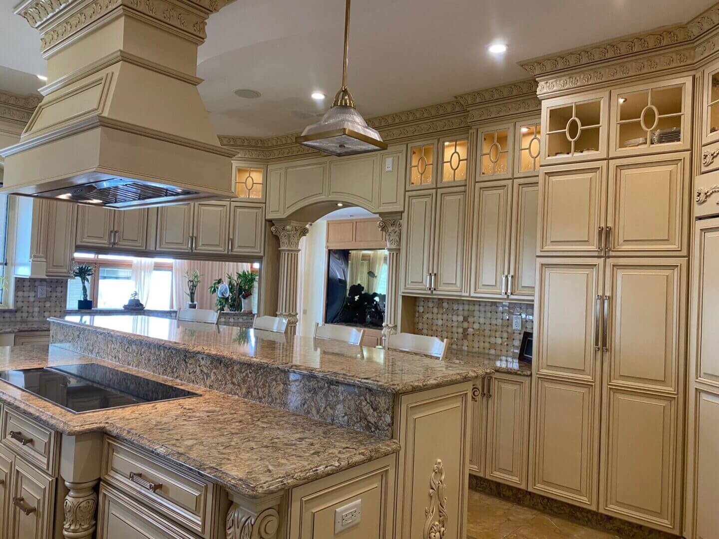 Elegant kitchen with marble countertops and vintage-style cabinetry.