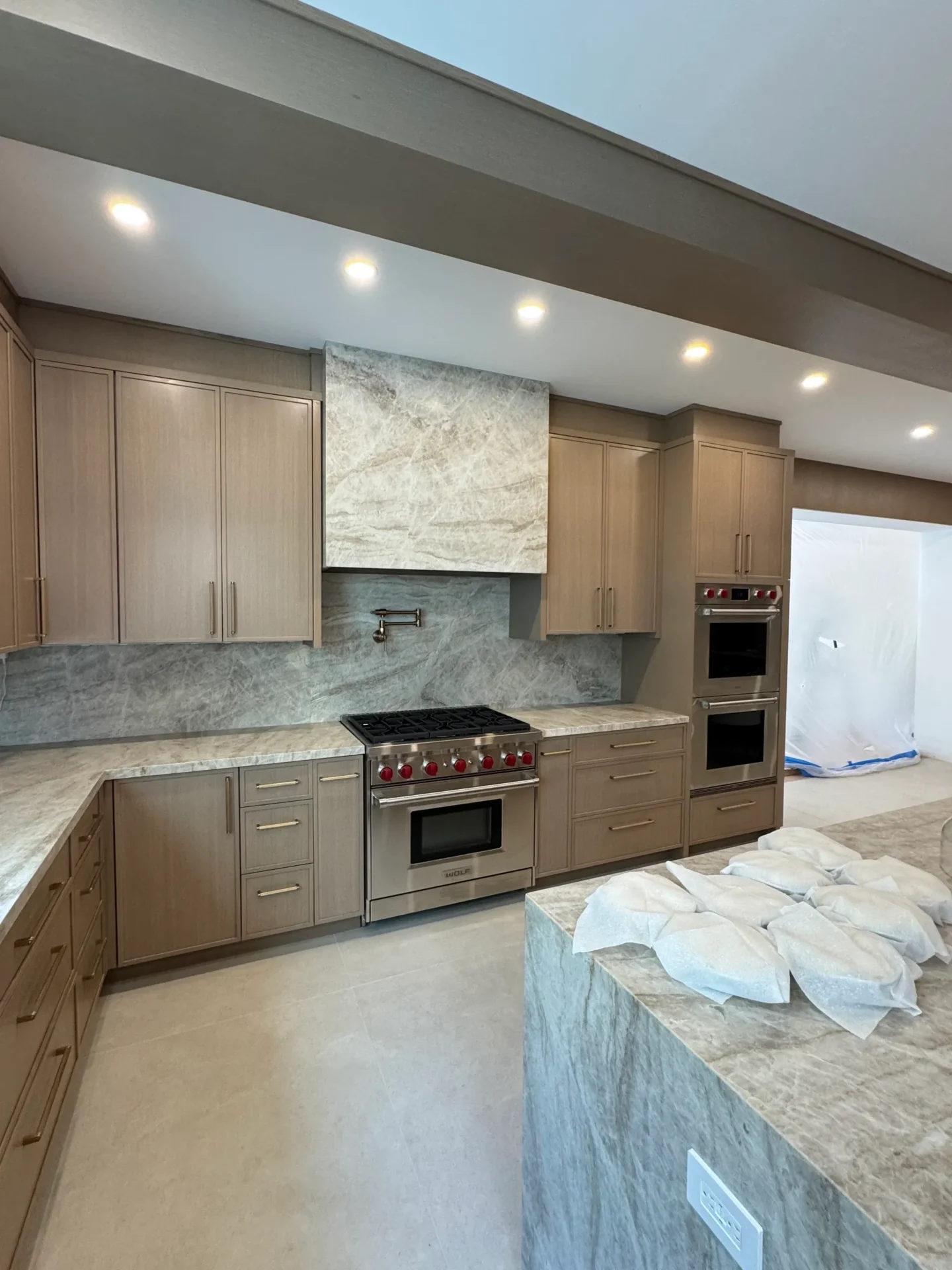Modern kitchen with wooden cabinets and stove.