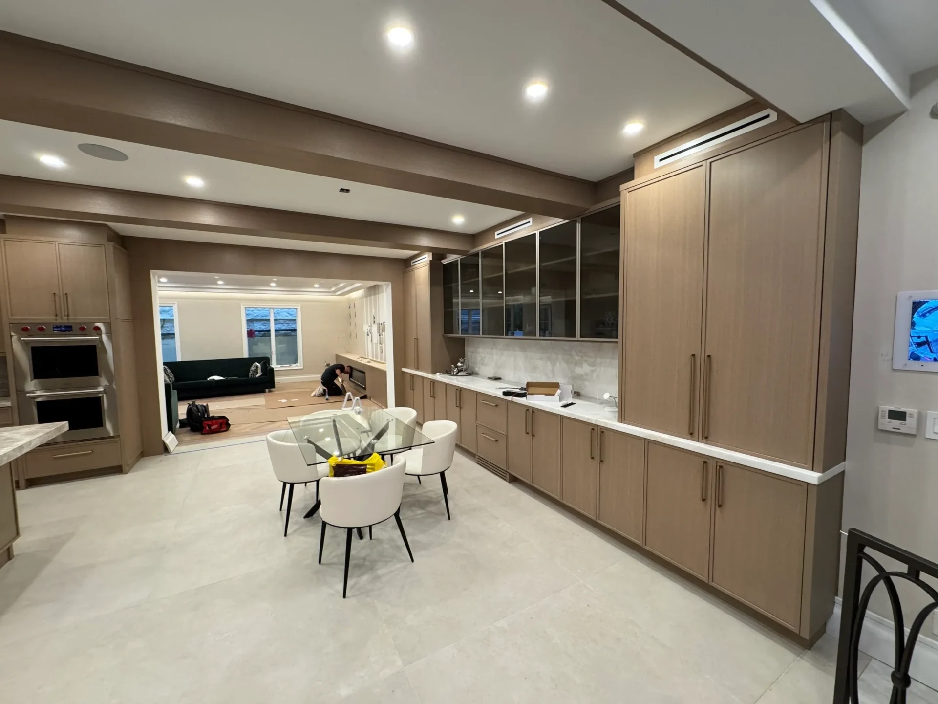 Modern kitchen with dining table and chairs.