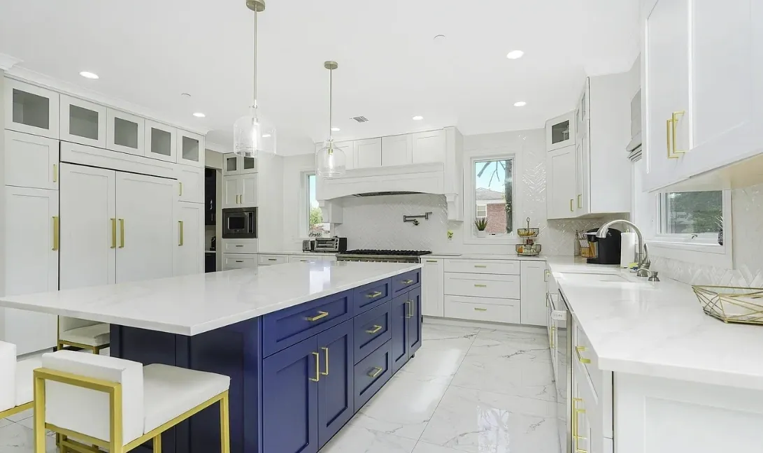 Modern white kitchen with blue island