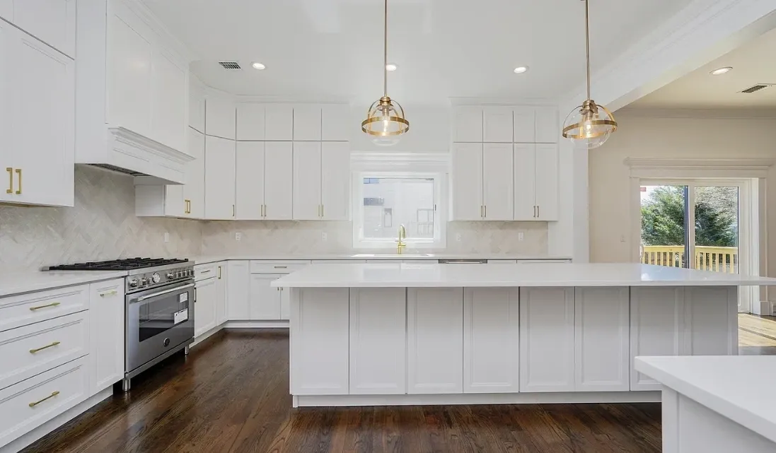 Bright modern white kitchen with large island