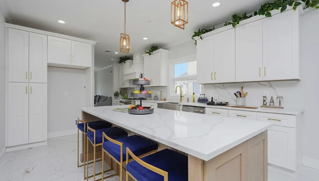 Modern white kitchen with island and stools