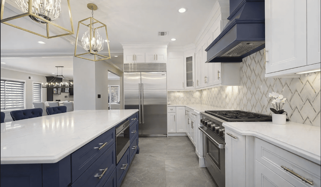 Modern kitchen with navy island and stainless appliances