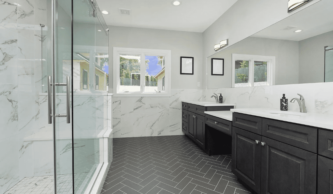 Modern bathroom with double vanity and glass shower